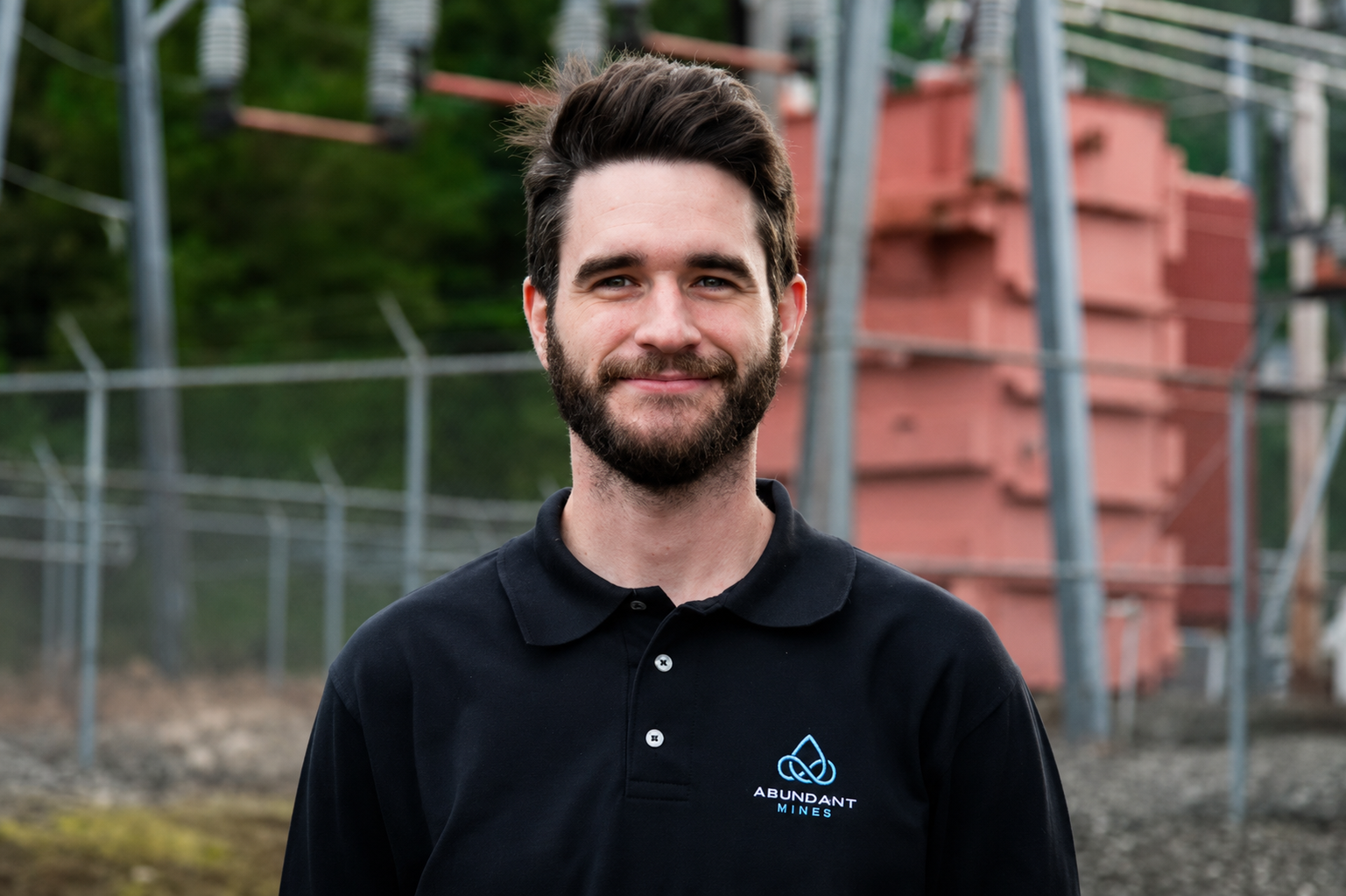 Beau Turner, CEO of Abundant Mines, at a mining facility substation