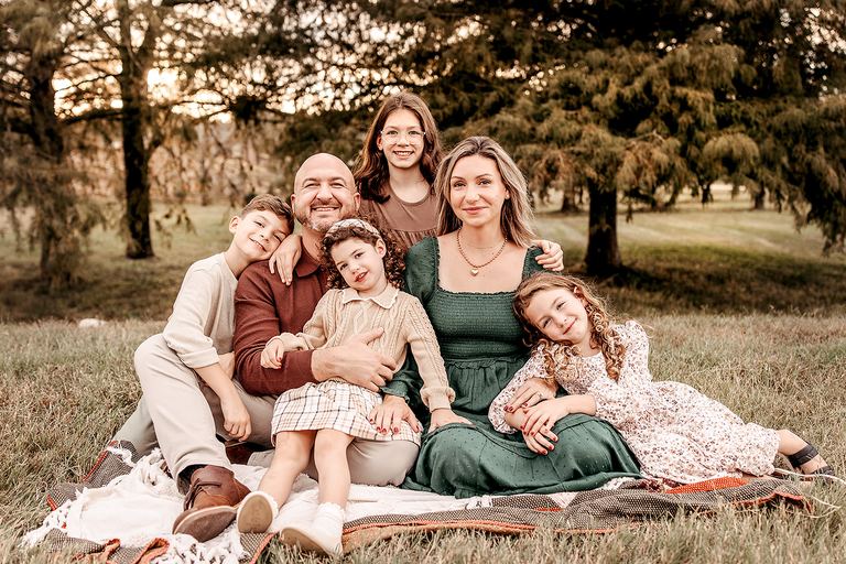The Cavuoto family together in a field.