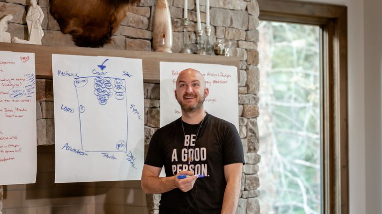 Nick Cavuoto mapping a framework on a whiteboard.
