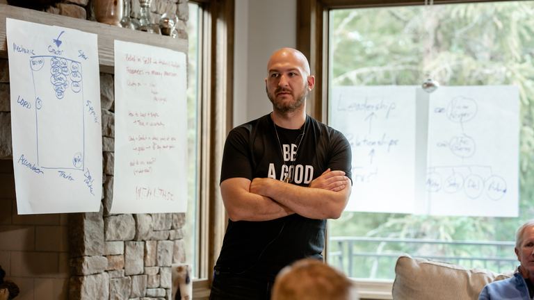 Nick Cavuoto leading a working session at a whiteboard.