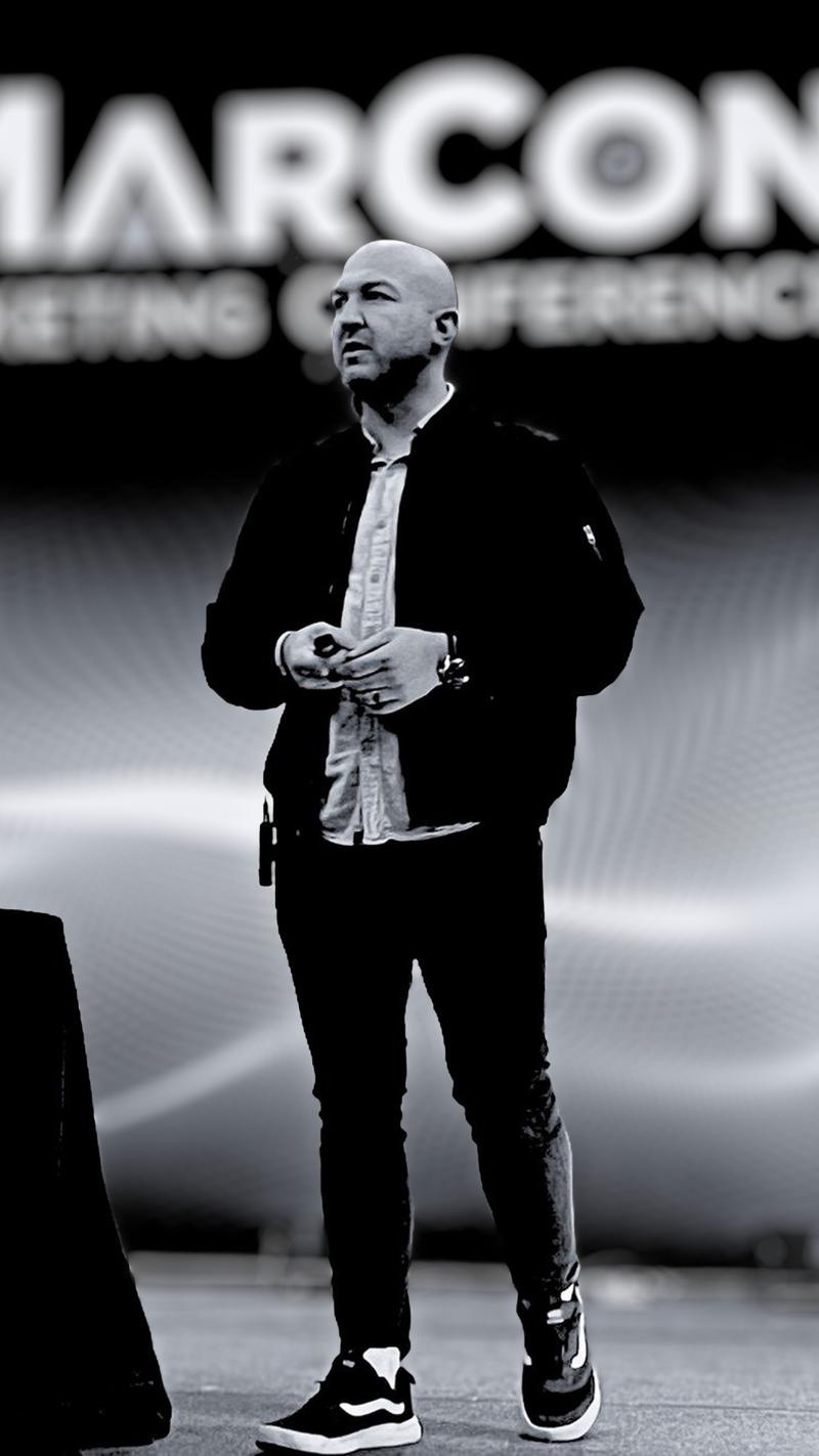 Nick Cavuoto speaking on stage.